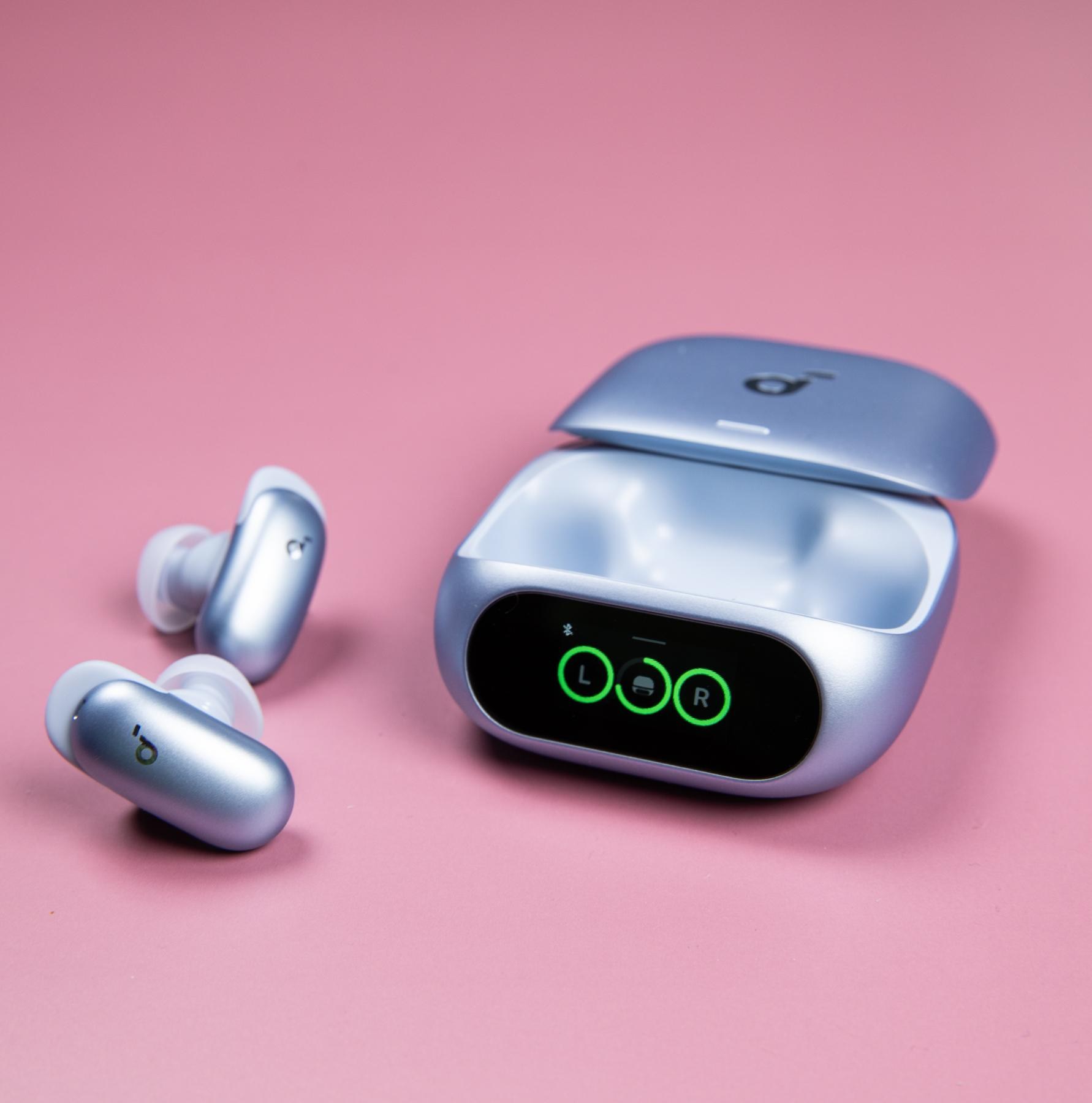 The blue Soundcore Liberty 5 Pro earbuds sitting next to their open case on a mauve background.
