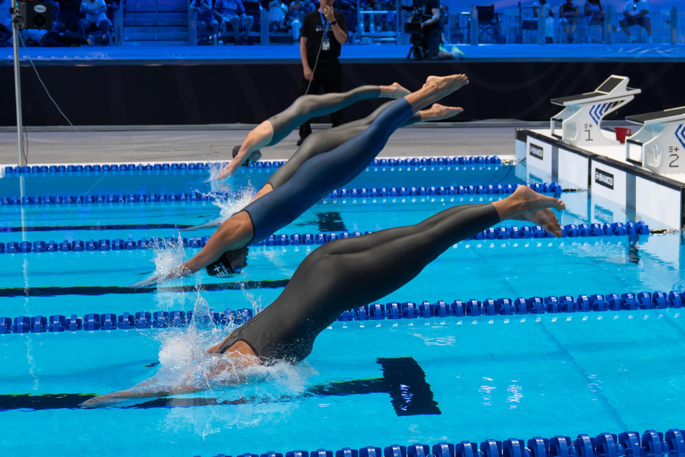 The polyurethane suits worn by swimmers competing in the Enhanced Games are banned in Olympic competition.