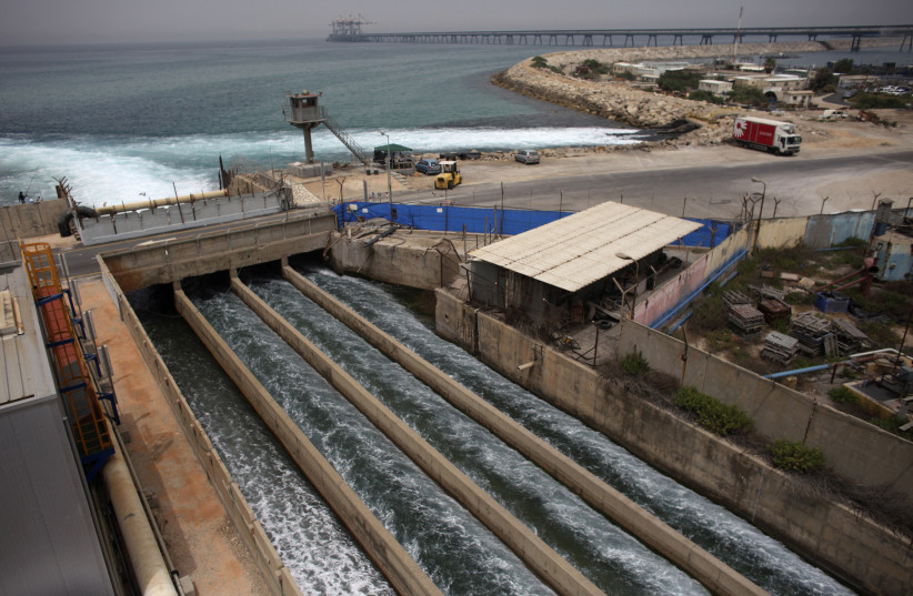 Brine water flows into the Mediterranean Sea after passing through a desalination plant in the coastal city of Hadera