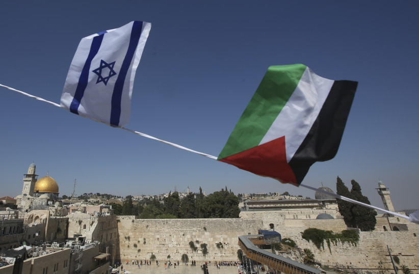Palestinian and Israeli flags overlook Dome of Rock and Western Wall