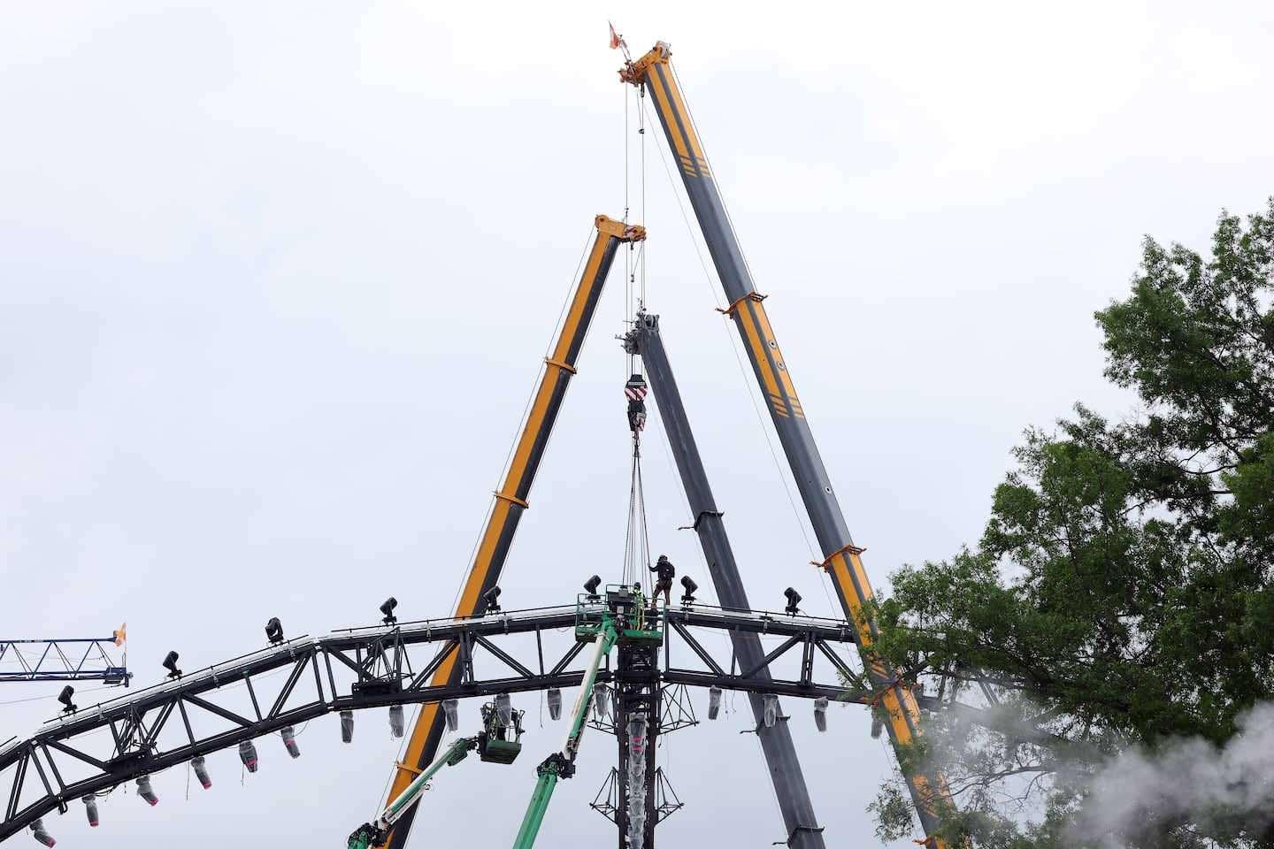 Crews worked on cranes while building the UFC 250 Freedom ring ahead of the June 14 event.