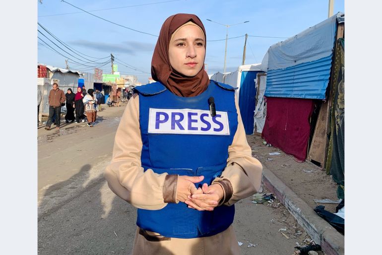 Ola Abu Moamer, pictured here in full press gear, has become a prominent voice reporting on the famine and displacement from the camp. [nstagram/@ola_abu_moamer]