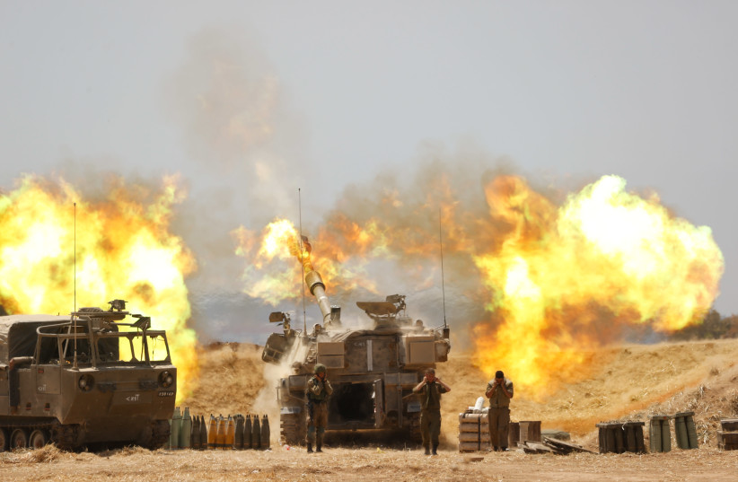 IDF Artillery Corps are seen firing into Gaza following heavy rocket and missile barrages fired into Israel from the Strip, on May 12, 2021.