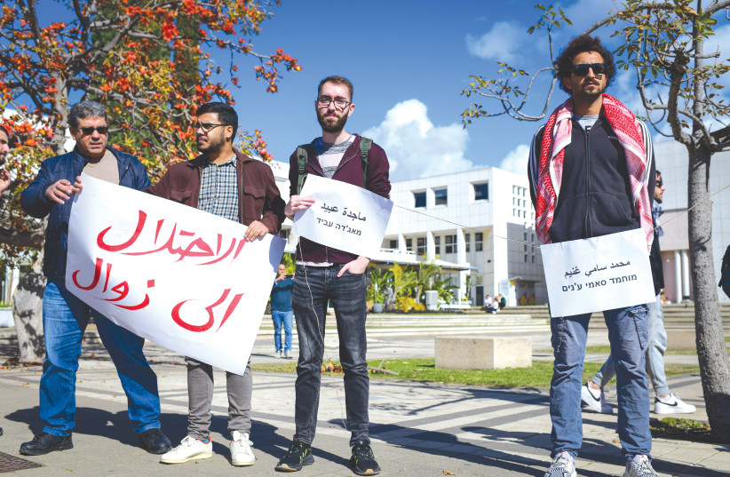 ISRAELI ARAB students and other activists protest against an IDF operation in Jenin, at Tel Aviv University.