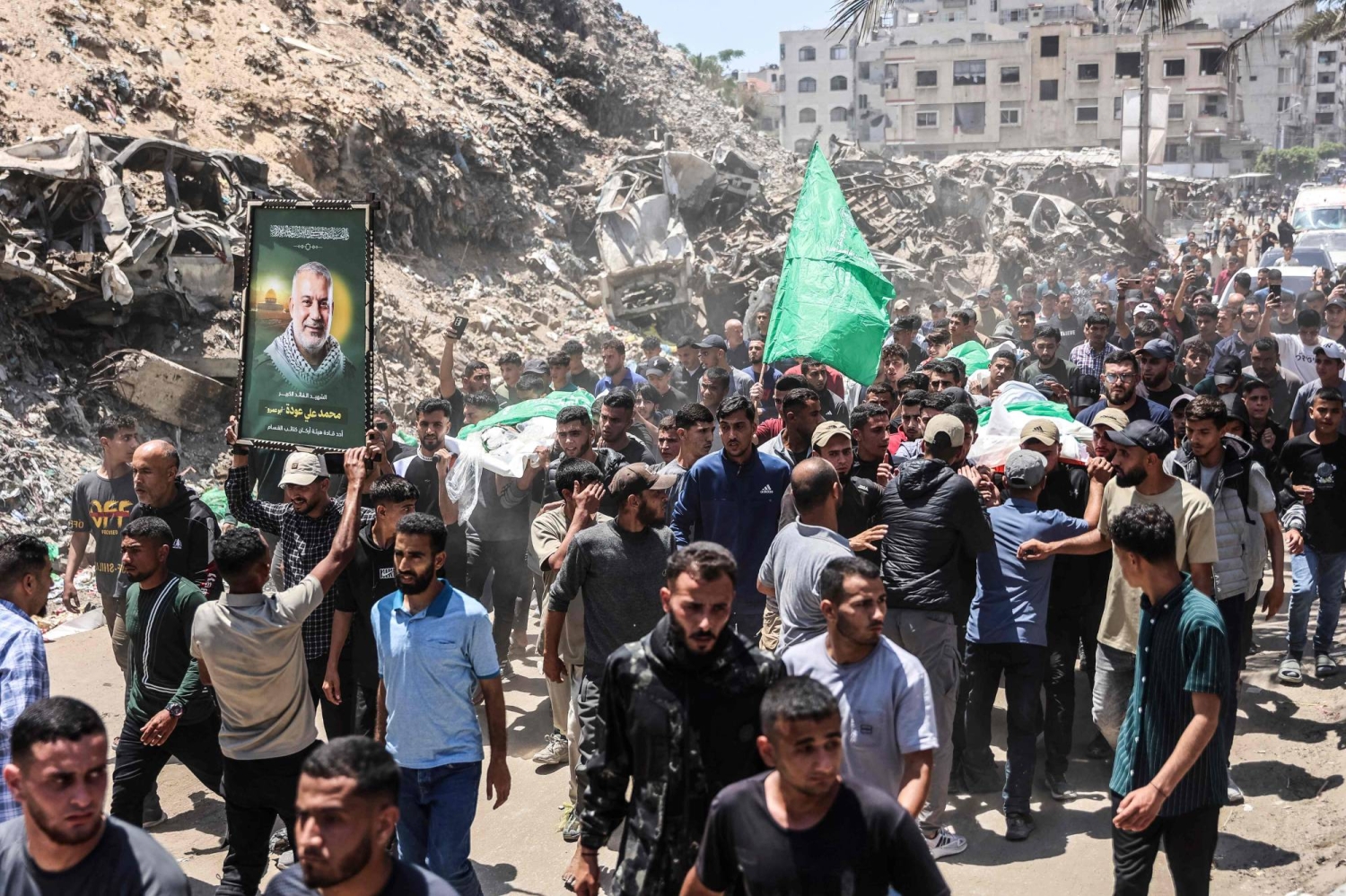 Palestinians mourn slain Hamas militant chief as Israel escalates Gaza attacks