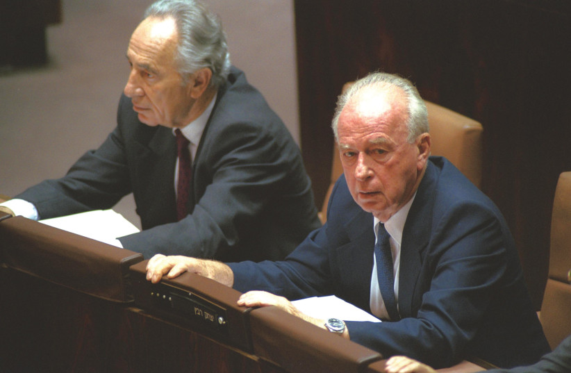 THEN-FOREIGN minister Shimon Peres and prime minister Yitzhak Rabin attend the Knesset debate on the Oslo I agreement on September 21, 1993.