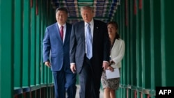 US President Donald Trump walks with Chinese leader Xi Jinping at Zhongnanhai Garden in Beijing on May 15.