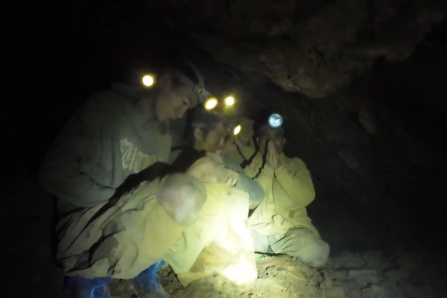 An image from a video taken on May 27 and provided by Norrased Palasing of Seascout Diving, shows people who have been trapped in a flooded cave in Xaysomboun province, northeast of the Lao capital Vientiane. (Photo via AFP)