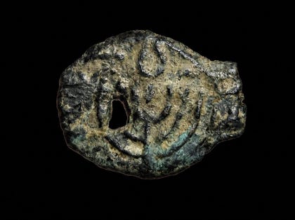 An ancient and rare coin depicting the seven-branched menorah that stood in the Temple in Jerusalem.