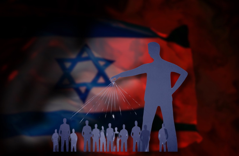 An illustrative image of a shadowy puppet master pulling the strings of many people set to a backdrop of an Israeli flag in dark lighting.
