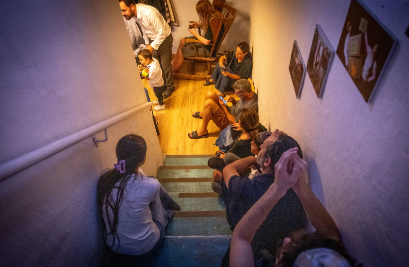 Israelis take cover in a public shelter in Jerusalem, during a ballistic missile attack fired from Iran into Israel June 13, 2025.