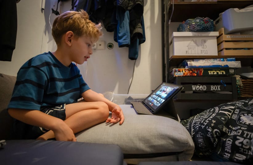 A young Israeli boy studies on Zoom at home during the recent war between Israel and Iran, June 22, 2025.