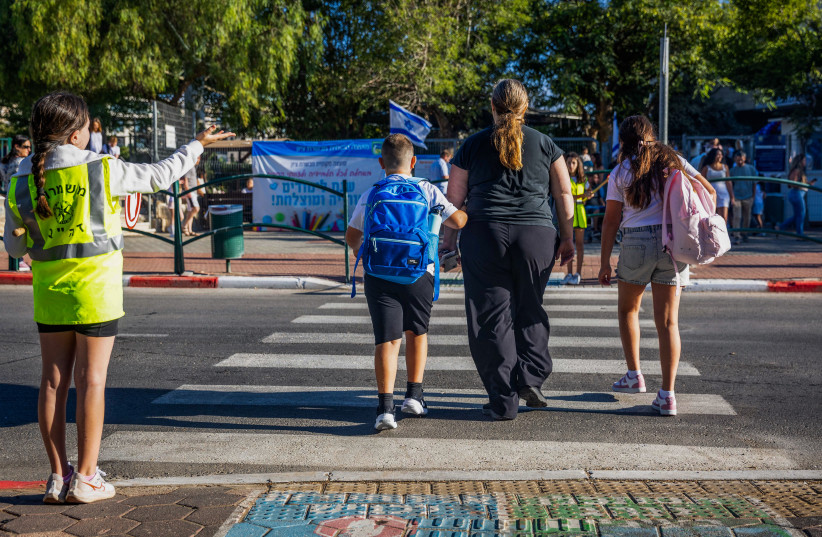 Children arrive for the first day of school in the Israeli town of Mevaseret Zion, September 1, 2025.