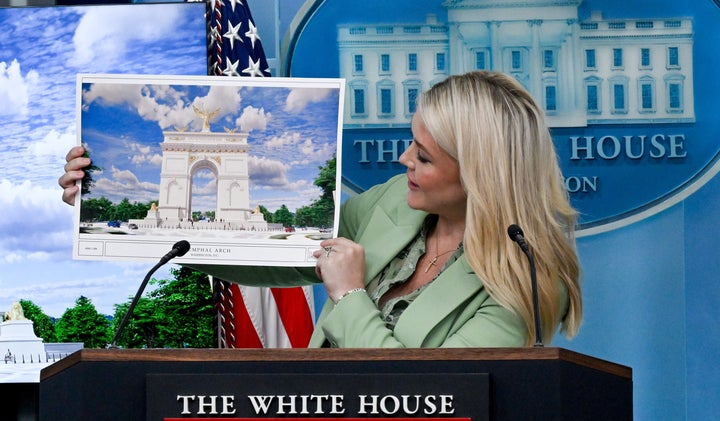 Karoline Leavitt, White House press secretary, displays an artist's rendering of President Donald Trump's planned Triumphal Arch during a news conference in the James S. Brady Press Briefing Room of the White House in Washington, DC, US, on Wednesday, April 15, 2026. Americans rushing to meet Wednesday's tax filing deadline are getting bigger refunds on average thanks to President Donald Trump's tax law, though the savings are falling short of his promises and many say they haven't noticed a difference. 