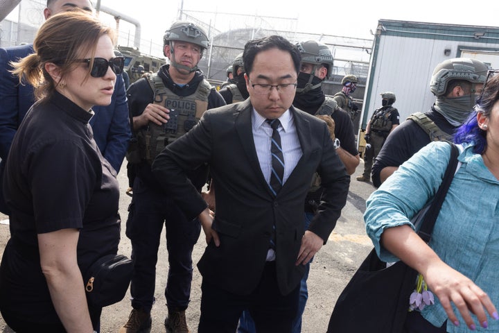 Kim, seen here Monday trying to broker an agreement between ICE agents and protesters.