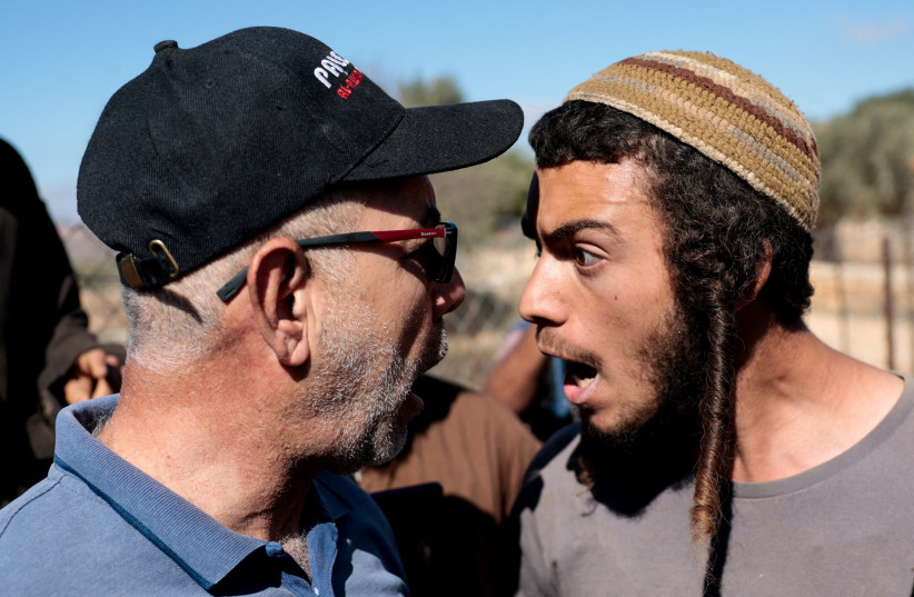 AN ISRAELI settler (R) and a Palestinian farmer are seen arguing during olive harvesting in Silwad, near Ramallah, on October 29, 2025.