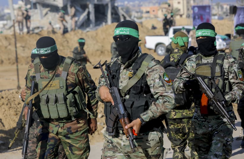 Hamas terrorists gather during a public event in Khan Younis, Gaza, on February 1, 2025. 