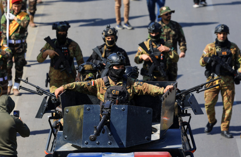 Members of the Iraqi armed group Kataib Hezbollah attend the funeral of their members, who were killed in an airstrike that targeted a Hashd al‑Shaabi headquarters near the western al‑Qaim district on the Syrian border, amid the U.S.-Israel conflict with Iran, in Baghdad, Iraq, March 2, 2026.