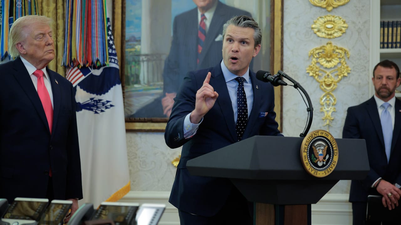 US Secretary of Defense Pete Hegseth talks about the war in Iran as President Donald Trump hosts the swearing-in ceremony for US Secretary of the Department of Homeland Security Markwayne Mullin (R) in the Oval Office at the White House on March 2. 