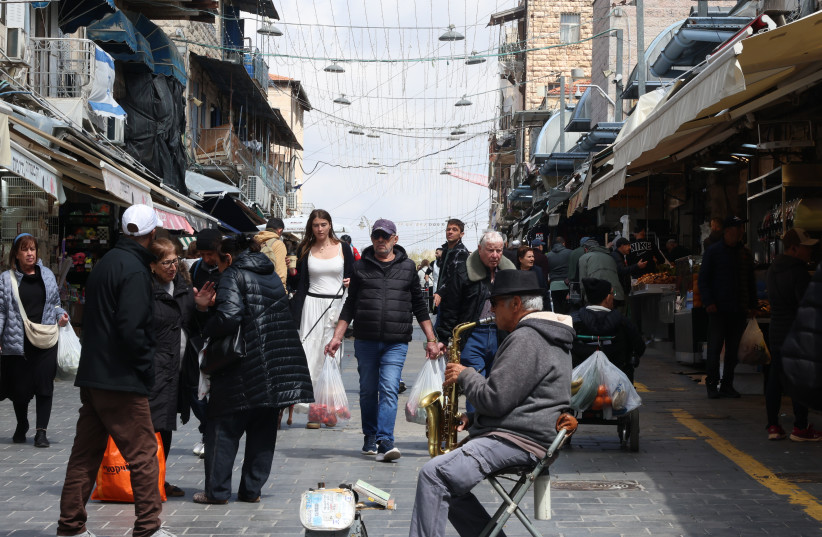 Israelis seen walking down Mahane Yehuda market, in Jerusalem, April 9, 2026