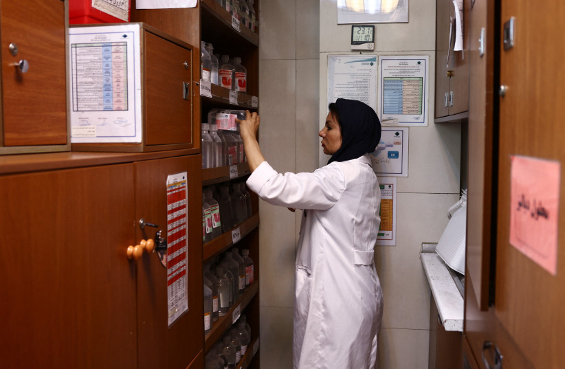 An Iranian nurse prepares medication at a hospital, amid a ceasefire between US and Iran, in Tehran, Iran, April 23, 2026. (credit: MAJID ASGARIPOUR/WANA