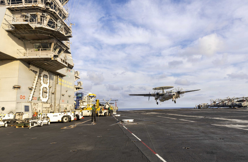An E-2D Hawkeye, assigned to Airborne Command and Control Squadron 124, lands on the flight deck of the world’s largest aircraft carrier, USS Gerald R. Ford (CVN 78), while underway in the Mediterranean Sea, April 12, 2026.