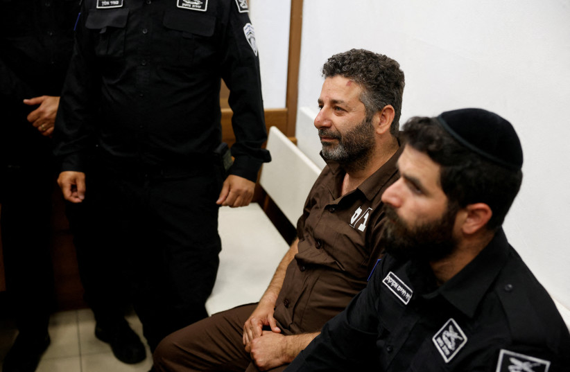 Activist Saif Abu Keshek, a member of the Global Sumud Flotilla detained by Israel, sits at a magistrate's court for a detention extension hearing in Ashkelon, southern Israel, May 3, 2026.