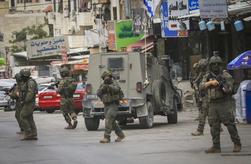 ISRAELI SECURITY forces operate during a raid in the West Bank city of Nablus, May 3, 2026.