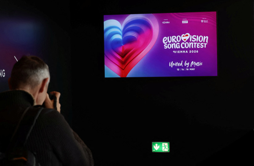 A photographer takes a picture of a TV screen in Wiener Stadthalle, the venue of Eurovision in Vienna, Austria, November 18, 2025