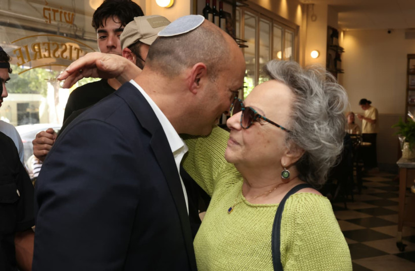 NAFTALI BENNETT at a coffee shop in Jerusalem, May 13, 2026.