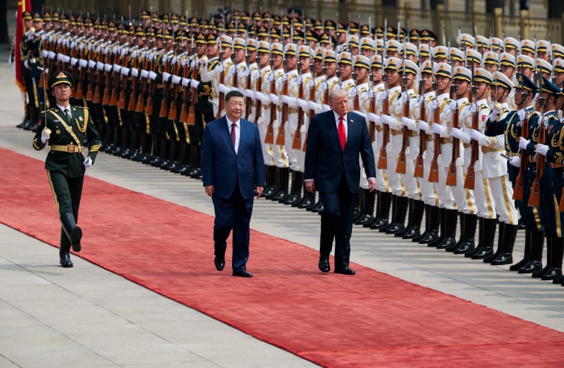 US President Donald Trump inspects an honour guard during a welcome ceremony with Chinese President Xi Jinping at the Great Hall of the People in Beijing, China, May 14, 2026.
