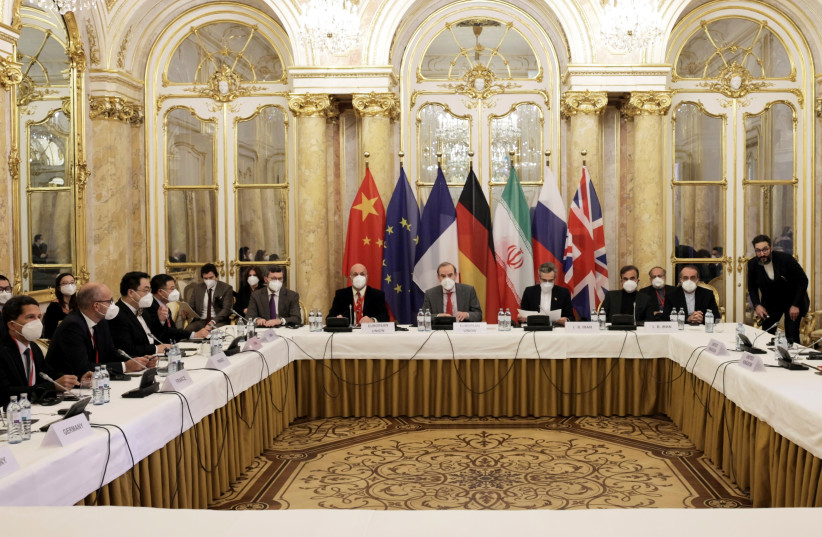 Deputy Secretary General of the European External Action Service (EEAS) Enrique Mora and Iran's chief nuclear negotiator Ali Bagheri Kani and delegations wait for the start of a meeting of the JCPOA Joint Commission in Vienna, Austria December 17, 2021. (credit: EU Delegation in Vienna/EEAS/Handout via REUTERS)