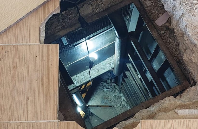 INSIDE THE remains of a small clothing store, where some articles of clothing still hung on racks, the ‘Post’ was shown a 25-meter shaft leading to an underground Hezbollah command center beneath the floorboards, where communications equipment, weapons, and uniforms were found.