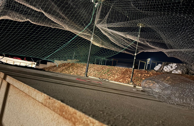 Anti-explosive drone barbed wire stretched over an army base, May 14, 2026.