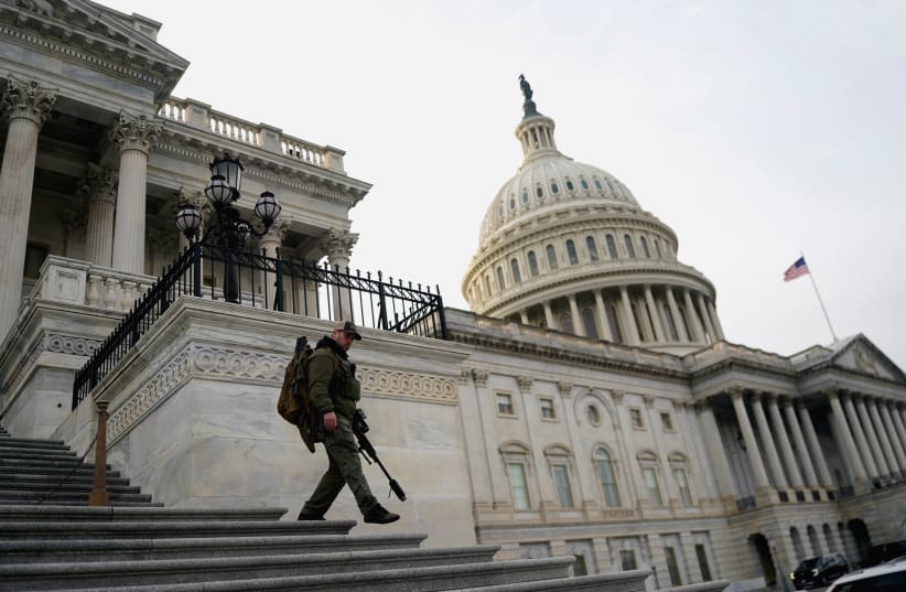 A member of the US Capitol police patrols following a vote in the US House of Representatives on a bipartisan war powers resolution aiming to stop Operation Epic Fury against Iran, on Capitol Hill, in Washington, DC, US, March 5, 2026.