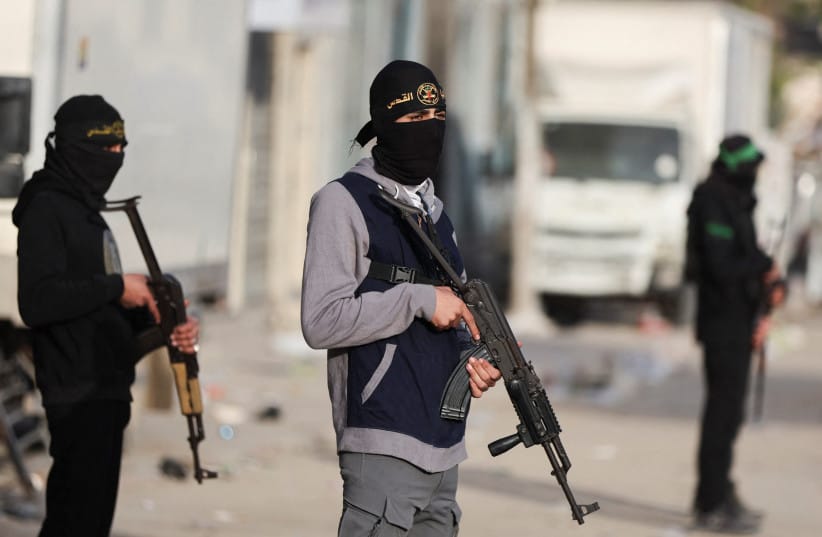 Terrorists from Hamas and Palestinian Islamic Jihad stand on a street during Eid al-Fitr in Gaza City, March 20, 2026.