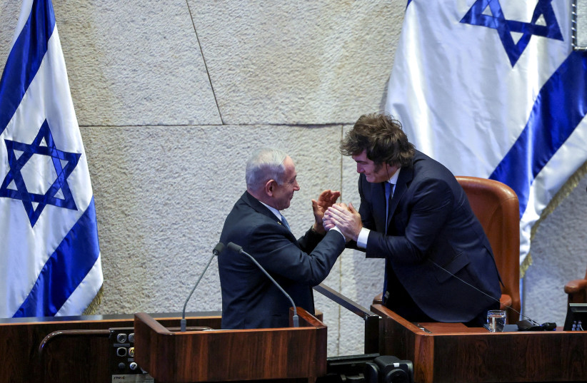 Argentine President Javier Milei and Prime Minister Benjamin Netanyahu greet each other during a session at the Knesset in Jerusalem in 2025.