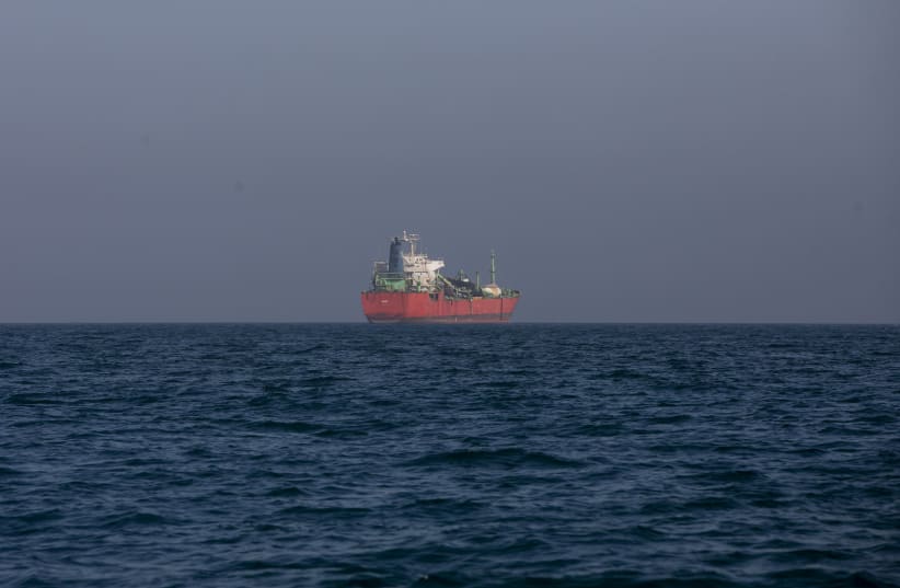 A ship that his struck earlier in the war remains anchored on May 16, 2026 in the Strait of Hormuz near Larak Island, Iran; Illustrative.