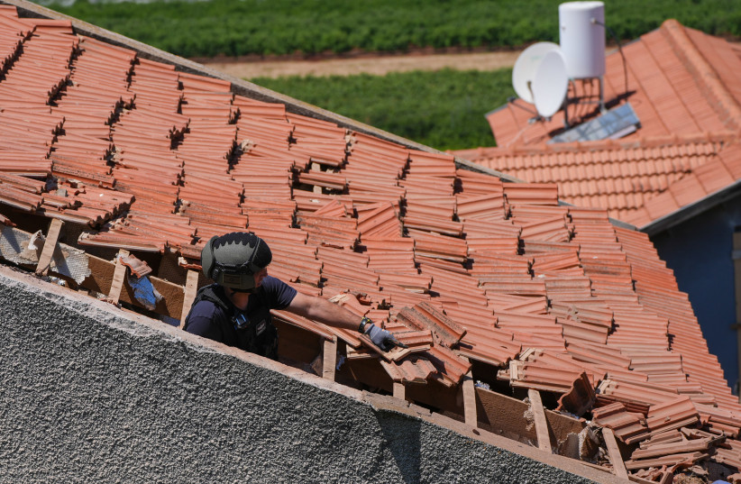 Israeli security forces at the scene where a house was hit by an explosive drone launched by Hezbollah from Lebanon in Metula near the Israeli-Lebanese border, May 25, 2026.