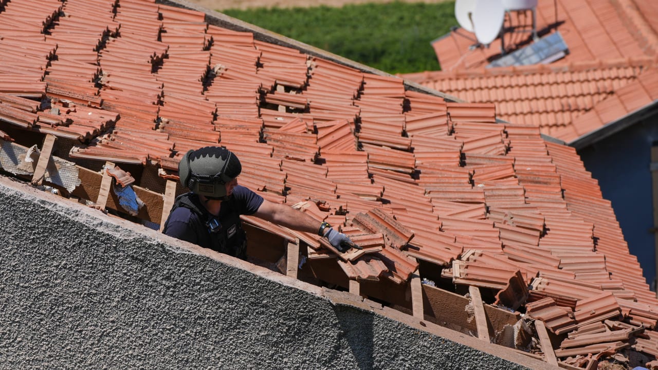 Israeli security forces at the scene where a house was hit by an explosive drone launched by Hezbollah from Lebanon in Metula near the Israeli-Lebanese border, May 25, 2026.