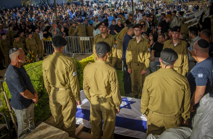 Family and friends of Israeli soldier Staff sergeant Noam Hamburger attend his funeral at the Military Cemetery in Atlit on May 24, 2026. He was killed in a Hezbollah explosive drone strike near the Israeli border with Lebanon.