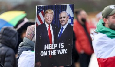 A PLACARD sends a clear message featuring US President Donald Trump and Prime Minister Benjamin Netanyahu, as protesters gather near the UN office during US-Iran nuclear talks, in Geneva, Feb. 17.