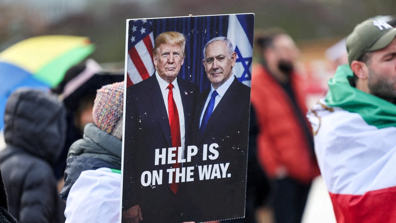 A PLACARD sends a clear message featuring US President Donald Trump and Prime Minister Benjamin Netanyahu, as protesters gather near the UN office during US-Iran nuclear talks, in Geneva, Feb. 17.