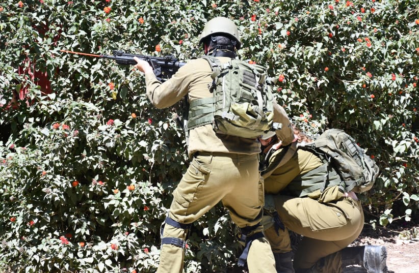 NEW MEMBERS of the Nir Oz security team train to respond to threats.