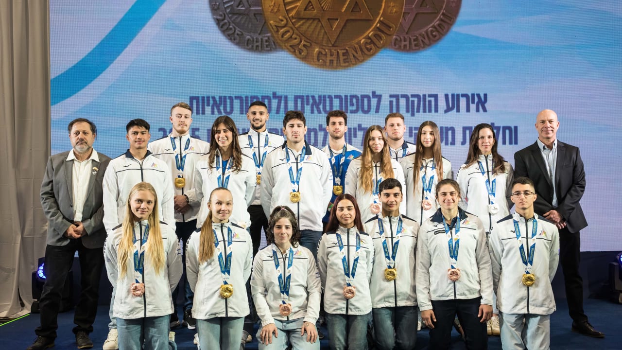 ARI STEINBERG (R), Chairman of Wingate Sport Institute and CEO of Ashmoret, and the athletes who won medals at the 2025 World Games.