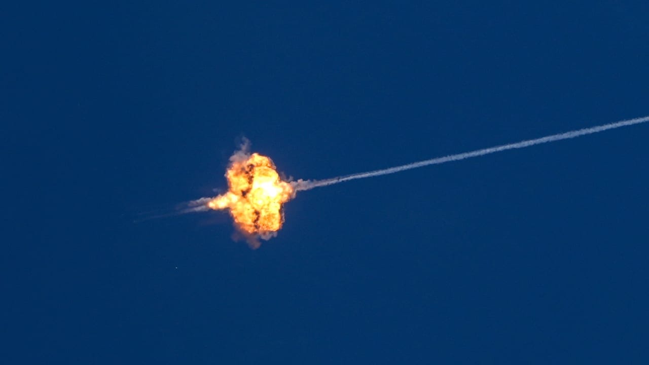 Israeli security forces and civilians at the scene where a missile fired from Lebanon toward Israel overnight caused damage in the northern Israeli city of Kiryat Shmona, May 30, 2026.