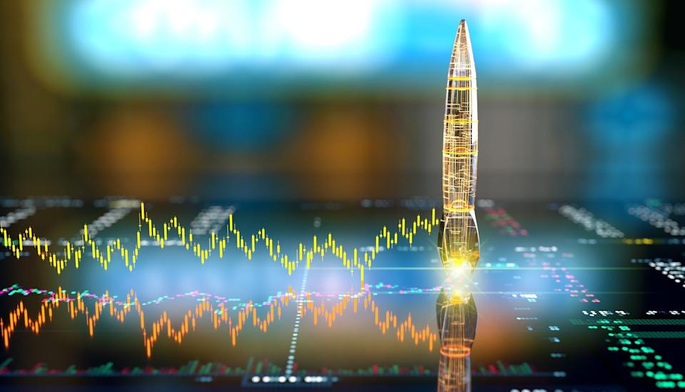 A rocket blasts off from a digital screen.