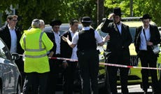 Locals in Golders Green talk to police after two Jewish men were stabbed in the neighborhood, which has a large Jewish population.