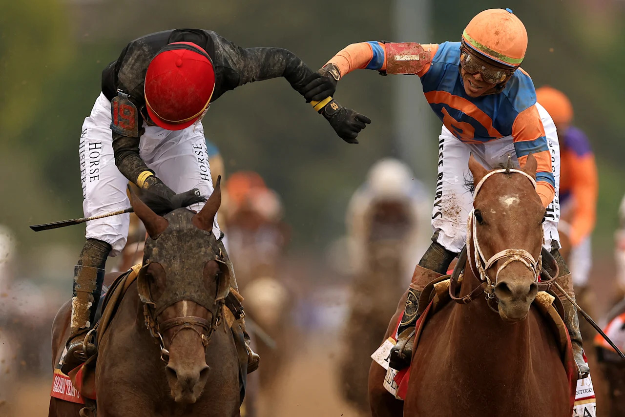 LOUISVILLE, KENTUCKY - MAY 02: Golden Tempo #19, ridden by jockey Jose Ortiz, celebrates with Renegade #1, ridden by jockey Irad Ortiz Jr., after cross the finish line to win the 152nd running of the Kentucky Derby at Churchill Downs on May 02, 2026 in Louisville, Kentucky. (Photo by Steph Chambers/Getty Images)