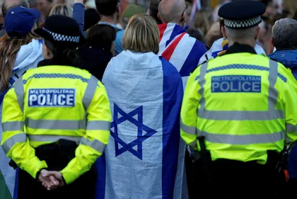 Metropolitan Police officers stand on duty as people attend a rally organised by the Campaign Against Antisemitism, opposite Downing Street in central London late April, following the stabbing of two Jewish men the day before in the Golders Green neighbourhood of north London. Credit: Carlos Jasso/AFP Metropolitan Police officers stand on duty as people attend a rally organised by the Campaign Against Antisemitism, opposite Downing Street in central London late April, following the stabbing of two Jewish men the day before in the Golders Green neighbourhood of north London.